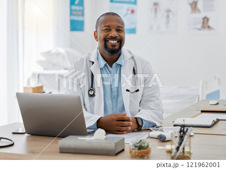 Doctor, medical healthcare worker and male physician at hospital or clinic working with stethoscope and electronics. GP man on laptop reading emails, patient records and documents in covid pandemic 121962001