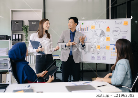 Creative business people working on business project in office 121962382