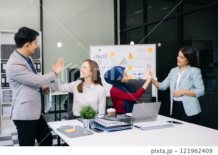 Two confident business man shaking hands during a meeting in the office, success, dealing, greeting and partner] 121962409