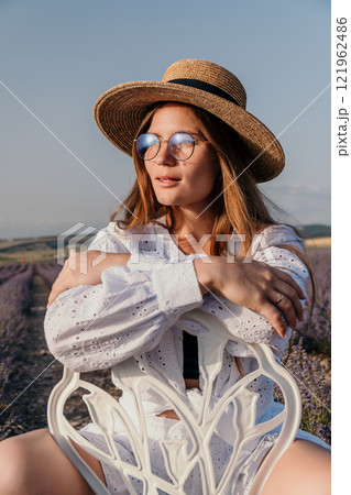 Woman Lavender Field Summer Fashion: Relaxed pose, sunlit, outdoor photoshoot, Provence-style. 121962486