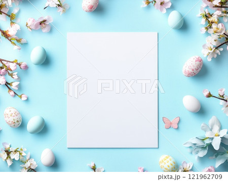 Easter themed blank poster mock up on pastel blue background with decorative eggs and flowers 121962709