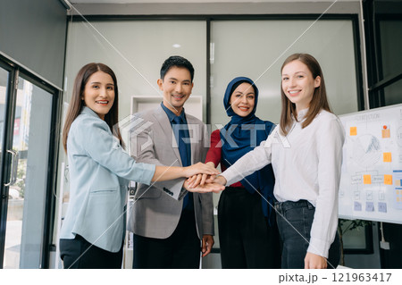 Business partnership handshake concept.Photo Multiracial team coworkers handshaking process.Successful deal after great 121963417