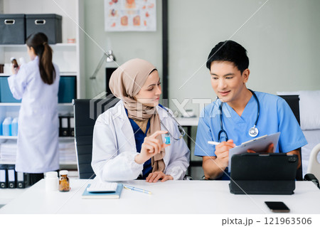 Medical, meeting and laptop for team in discussion, brainstorming and planning. Doctor, nurse on desk show diversity in collaboration, teamwork or workshop Medical, meeting and laptop for team in discussion, brainstorming and planning. Doctor, nurse on desk show diversity in collaboration, teamwork or workshop 121963506