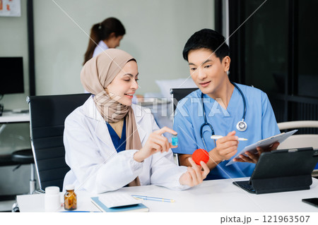 Medical, meeting and laptop for team in discussion, brainstorming and planning. Doctor, nurse on desk show diversity in collaboration, teamwork or workshop 121963507