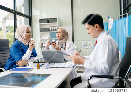 Medical, meeting and laptop for team in discussion, brainstorming and planning. Doctor, nurse on desk 121963712