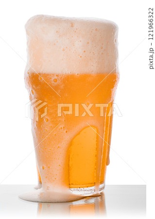 Golden beer overflowing with foam 121966322