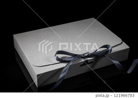 Man gift concept. gift box with luxury bow on dark background. Horizontal with copy space. 121966783