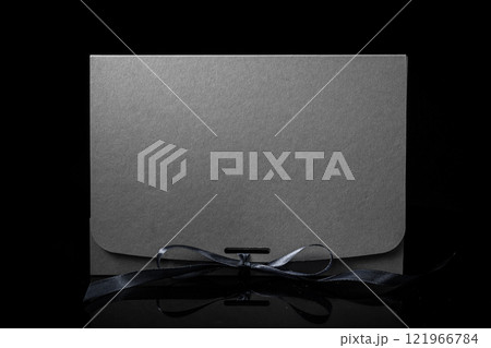 Man gift concept. gift box with luxury bow on dark background. Horizontal with copy space. Man gift concept. gift box with luxury bow on dark background. Horizontal with copy space. 121966784