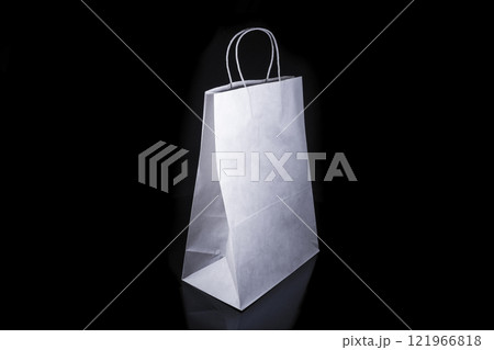 Recyclable craft paper bag for purchases, gifts and takeaway food mock up on black background. Environmentally friendly than single-use plastic bags Recyclable craft paper bag for purchases, gifts and takeaway food mock up on black background. Environmentally friendly than single-use plastic bags 121966818