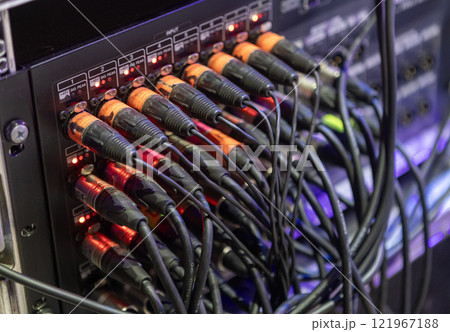 microphone plugs xlr of audio cables plugged into a mixing console or audio interface microphone plugs xlr of audio cables plugged into a mixing console or audio interface 121967188