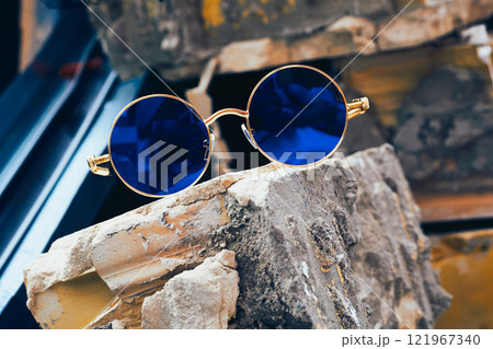 Vintage cool gold sunglasses with blue lenses in old brick Vintage cool gold sunglasses with blue lenses in old brick 121967340
