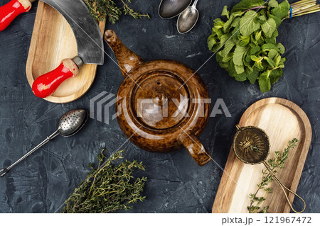 Teapot on table, herbal tea. 121967472