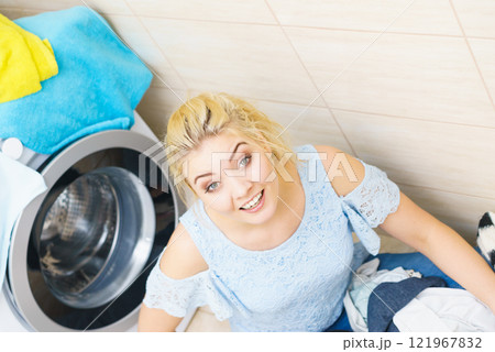 Unhappy woman having a lot of laundry 121967832