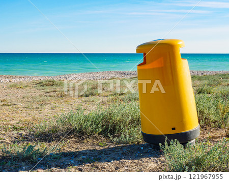 Empty beach with trash can 121967955