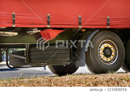 Spare tires attached to the rear of a large truck Spare tires attached to the rear of a large truck 121968058