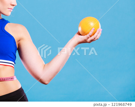 woman fit girl with measure tape and grapefruit 121968749