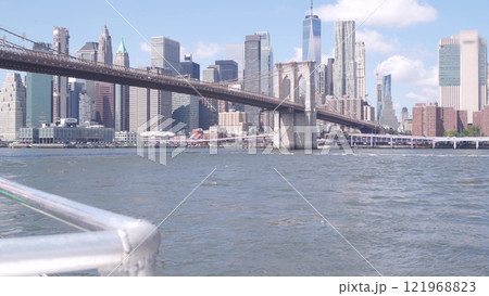 New York City downtown skyline from ferry boat. Manhattan bridge, East river, World Trade Center USA New York City downtown skyline from ferry boat. Manhattan bridge, East river, World Trade Center USA 121968823