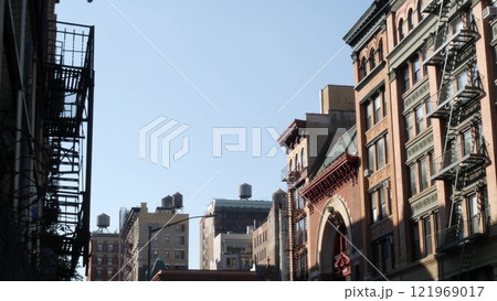 New York City Manhattan architecture, USA. Residential house exterior. Red brick facade, water tower 121969017