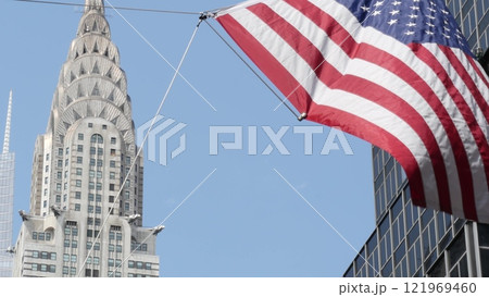 New York, american flag waving. Chrysler building. Manhattan midtown city street banner, patriotism. New York, american flag waving. Chrysler building. Manhattan midtown city street banner, patriotism. 121969460