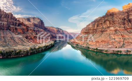 A beautiful river with a mountain range in the background 121969709