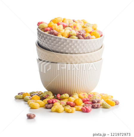Colorful breakfast cereals in the shape of various fruit in bowl isolated on white background. 121972973