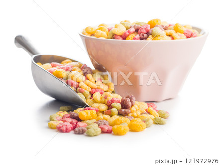 Colorful breakfast cereals in the shape of various fruit in scoop isolated on white background. 121972976