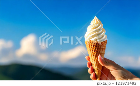 青空と白雲の背景に映えるバニラソフトクリーム　生成AI 121973492