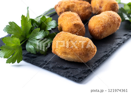Fried cod croquettes isolated on white background. Traditional spanish food Fried cod croquettes isolated on white background. Traditional spanish food 121974361