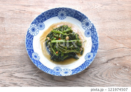 stir fried slice Chinese morning glory with chili on plate stir fried slice Chinese morning glory with chili on plate 121974507