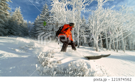 Freeride in fresh powder snow during sunny day. 121974562