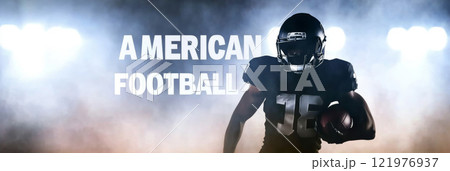 American football player in red uniform in action with stadium lights with text American football American football player in red uniform in action with stadium lights with text American football 121976937