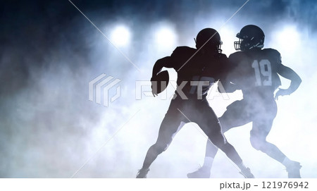 American football players in dynamic formation with misty background 121976942
