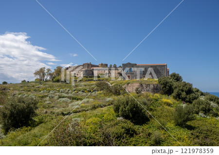 Green hill with the Milazzo Castle, Sicily, Italy Green hill with the Milazzo Castle, Sicily, Italy 121978359
