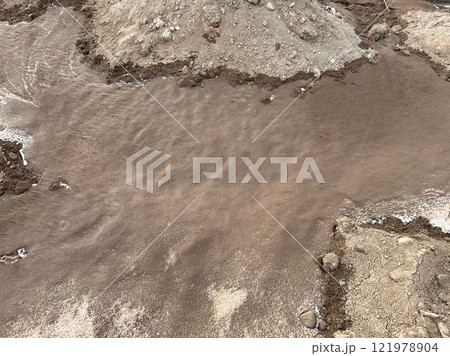 Melting snow on the ground 121978904