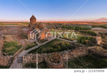 Aerial view of Hovhannavank monastery and Ohanavan village. Mount Ara, medieval church and Kasakh gorge and river canyon on sunny autumn sunset. Aragatsotn Province, Armenia. Europe. 121978999