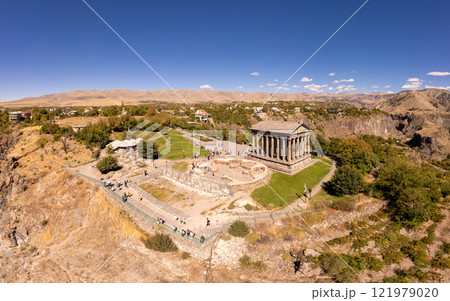 Aerial view of famous Garni pagan temple with Ionic-colonnaded. Historic Greek style building is located on gorge. Built in I century AD by Armenian king Trdat. Ancient Khosrov Reserve, Armenia Europe Aerial view of famous Garni pagan temple with Ionic-colonnaded. Historic Greek style building is located on gorge. Built in I century AD by Armenian king Trdat. Ancient Khosrov Reserve, Armenia Europe 121979020