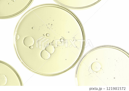 The texture of a cosmetic serum or body gel in a Petri dish. 121981572