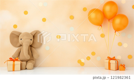 A toy elephant next to a colorful gift box and balloons, copy space 121982361