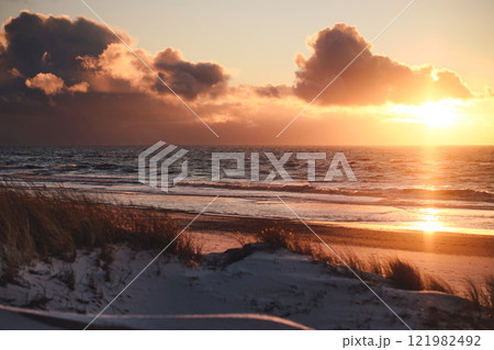 Sunset at Denmarks coast in winter 121982492