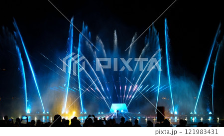 Impressive Performance Of Dancing Fountain With Blue Water Jets At Night 121983431
