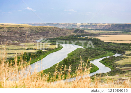 View to the river in the valley among badlands from the top of the hill. View to the river in the valley among badlands from the top of the hill. 121984056