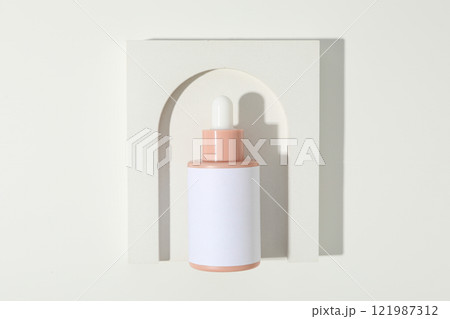 Cosmetic oil in a bottle with a decorative arch 121987312