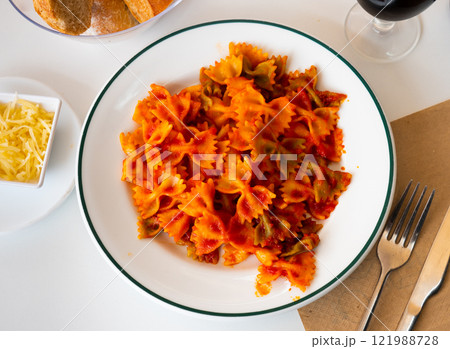 Lazos con tomate, spanish pasta in tomato sauce Lazos con tomate, spanish pasta in tomato sauce 121988728