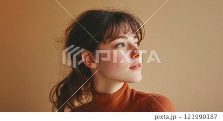 A young woman gazes thoughtfully into the distance. This image captures her natural beauty and elegance. The warm tones enhance the serene moment. Perfect for lifestyle or portrait themes. AI 121990187
