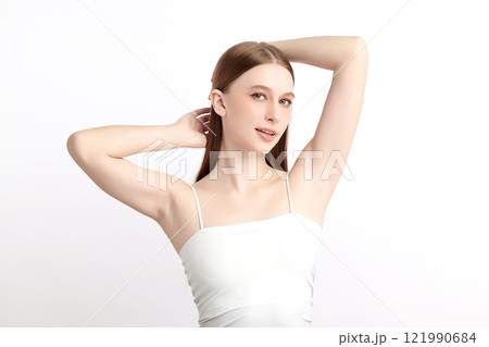 Beautiful Young woman lifting hands up to show off clean and hygienic armpits or underarms on white background, Smooth armpit cleanliness and protection concept 121990684