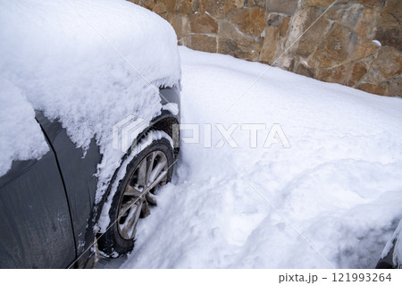 Car Buried in Snowy Landscape Car Buried in Snowy Landscape 121993264