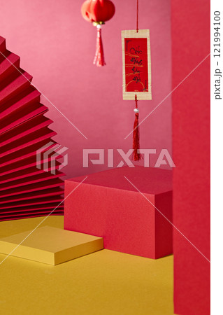 A minimalist Lunar New Year product ad image. A close-up of two platforms provides space for product display. Next to a red paper fan, lantern, and calligraphy as decoration, on a crimson background A minimalist Lunar New Year product ad image. A close-up of two platforms provides space for product display. Next to a red paper fan, lantern, and calligraphy as decoration, on a crimson background 121994100