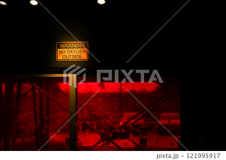 No oxygen sign on wall near red window 121995917