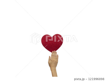 Female hand holds a red shiny heart. Template for designers 121996898