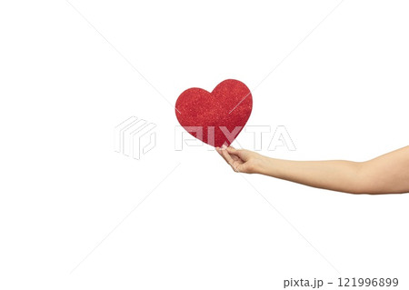 Female hand holds a red shiny heart. Template for designers Female hand holds a red shiny heart. Template for designers 121996899